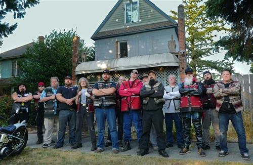 Spike, Hessian leader (left) and members of the Outsiders outside their clubhouse in Portland.